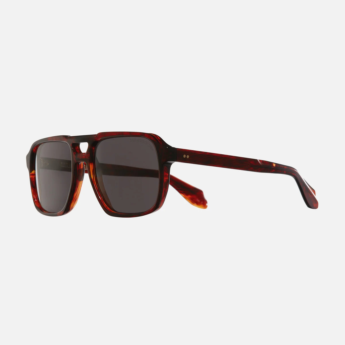 Sunglasses with tortoiseshell frame and dark lenses on a white background