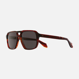 Sunglasses with tortoiseshell frame and dark lenses on a white background